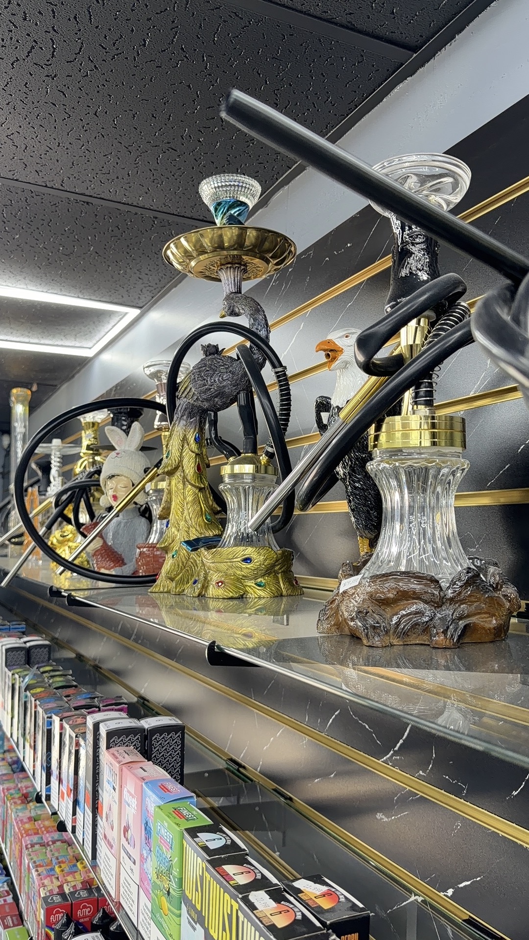 Luxury hookah collection on marble display shelf