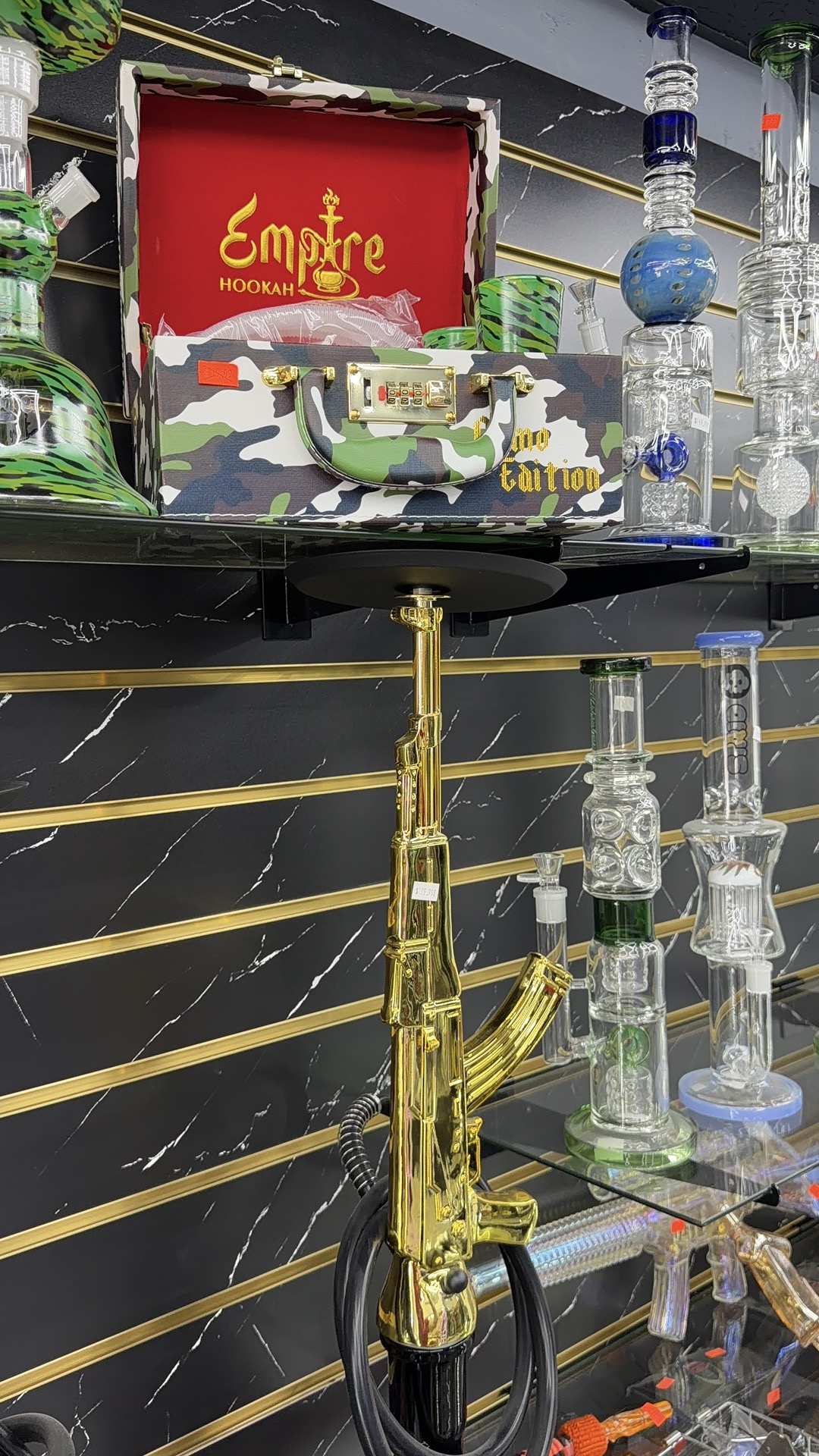 Gold AK hookah and Empire brand display